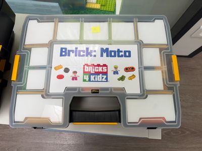 a plastic box with a game on it sitting on a table
