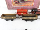 three toy trains sitting next to each other on a table