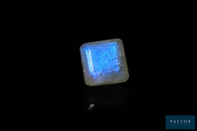 a close up of a square stone with a blue glow on it