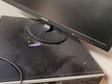 a computer monitor sitting on top of a dvd player