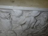 a sculpture of a group of people on a pedestal