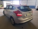 a silver car that is parked in a garage
