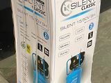 packaging of a blue silent classic electric air compressor sitting on the ground