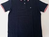 a black polo shirt with a red and white stripe around the collar