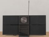 an image of a black stereo system on a wooden table