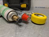 a gas can and a gas canister on a table
