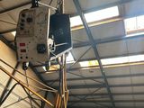 a crane that is sitting inside of a building