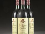 three bottles of wine sitting on top of a table next to each other