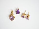 a pair of amethorate earrings and a pair of amethorate earrings