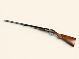 a rifle on a white background with a wooden handle