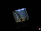 an image of a blue and white crystal on a black surface