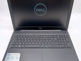 a close up of a dell laptop computer on a white surface