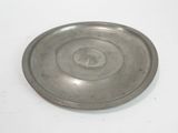 a silver plate that is sitting on a white table
