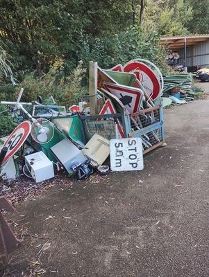 a pile of junk on the side of the road