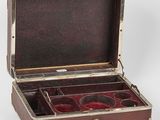 a small wooden box with three compartments on the inside