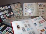 a lot of stamps on a table with a book