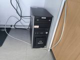 a computer that is sitting on the floor next to a laptop
