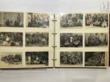 a book with pictures of people in it on display