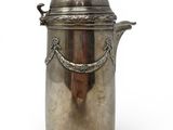 an antique silver plated ice bucket with a lid and a handle