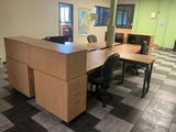 an image of an empty office with a desk and chairs