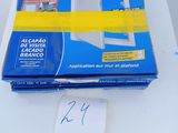 a box of tape on a table with a sticker on it