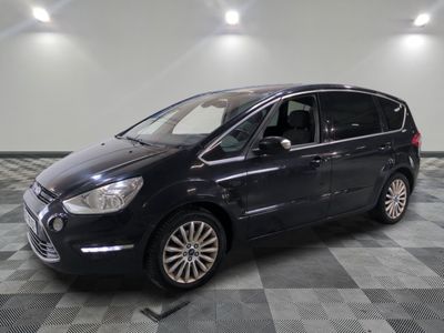 a picture of a black car parked on a checkered floor