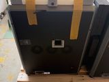 two refrigerators sitting on a pallet in a warehouse