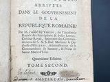 an old book with writing on it sitting on top of a table