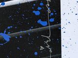 blue paint splattered on a black and white painting of a man in a boxing ring