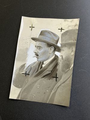 a black and white photo of a man with a mustache and a hat