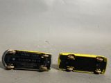 two batteries that are sitting next to each other on a table