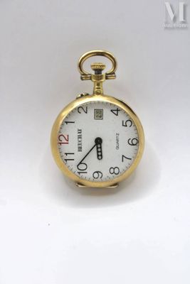 a gold pocket watch with a white face on a white surface