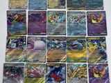 a bunch of pokemon cards sitting on top of a table
