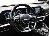the interior of a car with a steering wheel and dashboard controls