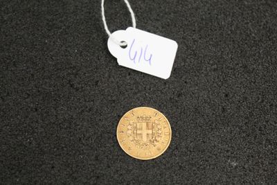 a small coin and a tag on a black surface