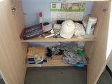 a wooden cabinet with a helmet and other items on it
