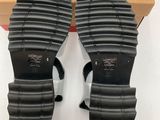 the back of a pair of women ' s black sandals in a box