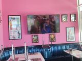 a pink and black checkered floor in a restaurant