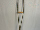 an old crutt with a wooden handle on it