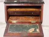 an old wooden desk with a marble top and drawers