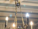 a chandelier hanging from the ceiling in a room