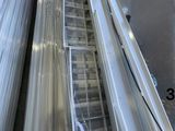a man riding an escalator in a warehouse