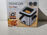 boxed box of a deep fryer sitting on a counter top