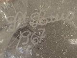 a picture of a broken glass bottle on the floor