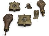 a lot of antique items that are on a white surface