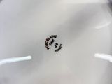 a close up of a white plate with a smiley face on it