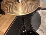 a drum set up in a recording studio with a microphone
