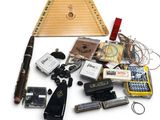 an image of a variety of musical instruments and accessories laid out on a white surface
