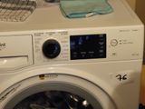 a washing machine that is sitting on top of a counter