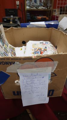 a cardboard box that has a bunch of papers in it